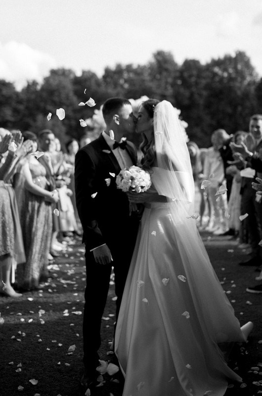 Bride and groom walking through a London street