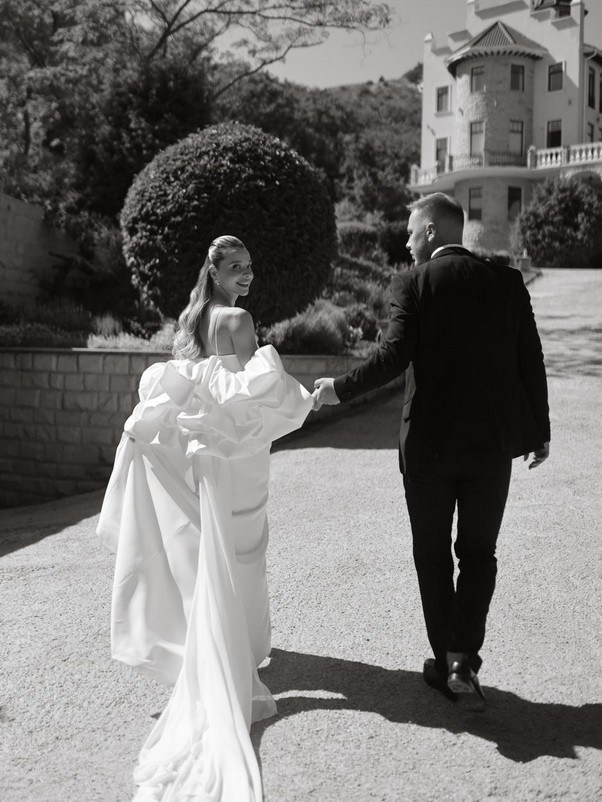 Black and white editorial-style wedding portrait in the Cotswolds