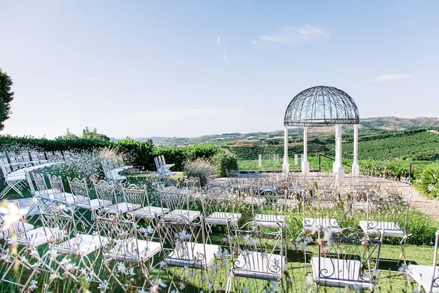 Spain wedding ceremony chairs and arch outdoors