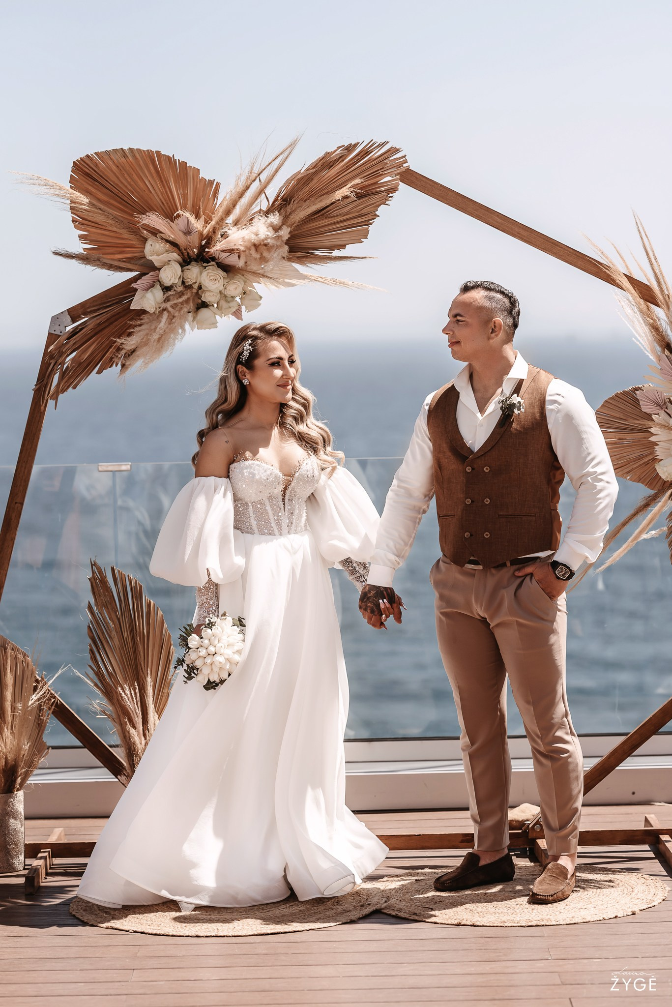 Wedding ceremony groom and bride on the beach