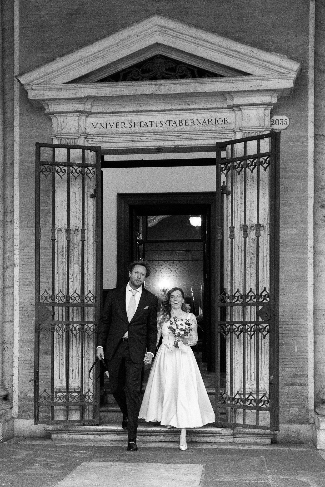Newly weds exiting the historic Sala Rossa at Campidoglio.