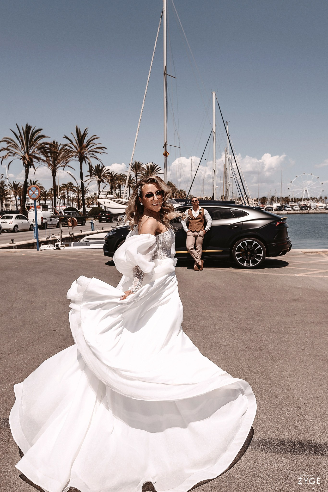 Bride in a Wedding dress with palms, yachts, and Lamborghini